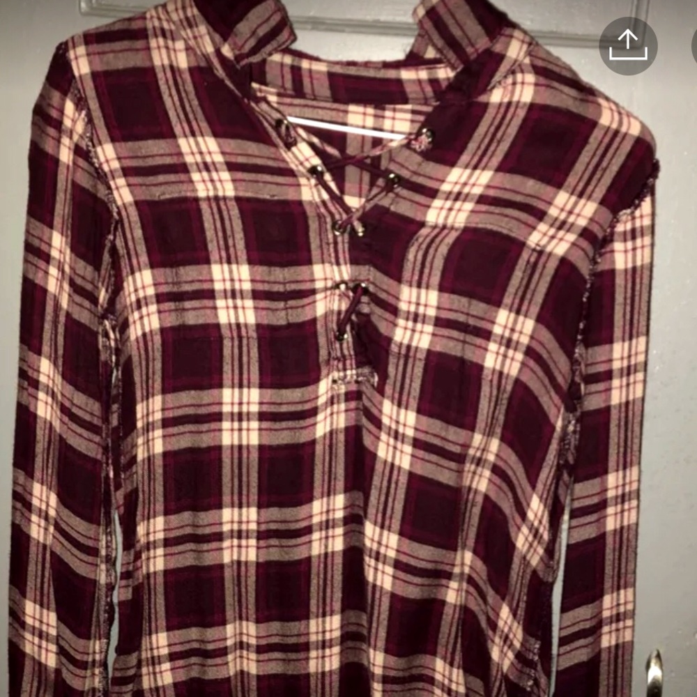 Very cute flannel shirt , it’s an XL in kids.